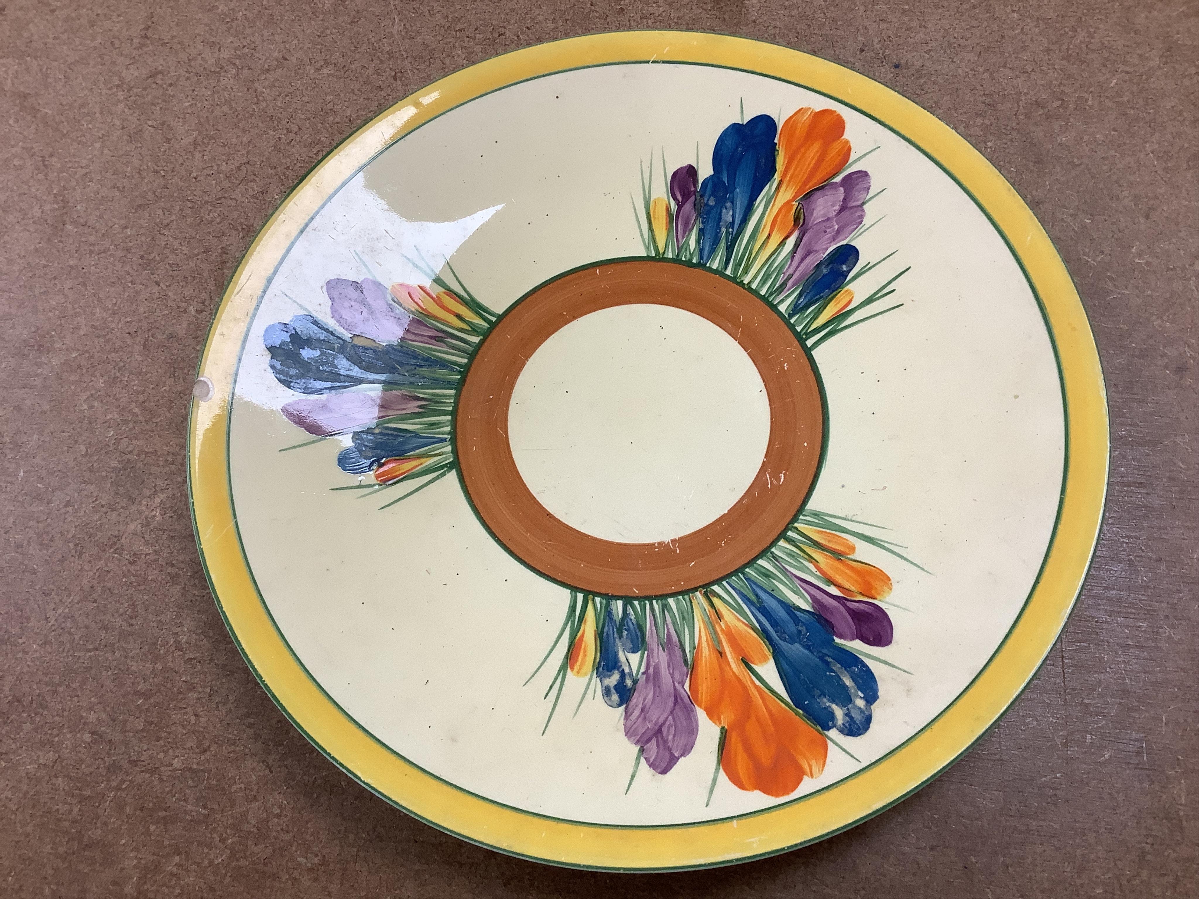 Collection of Clarice Cliff crocus pattern tea wares to include trios, milk jug, and a bowl, largest 22cm in diameter